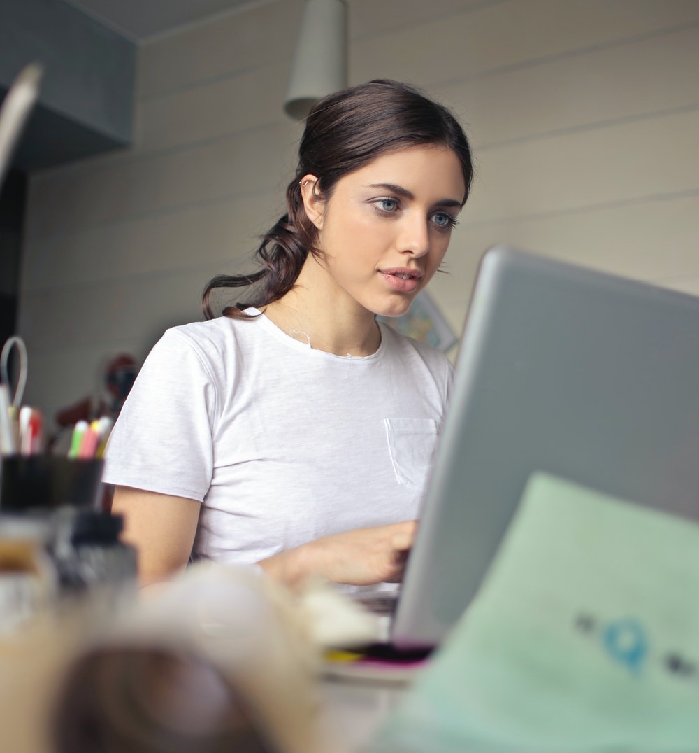 Picture of a women typing on a computer